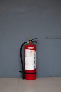 fire extinguisher against the wall